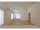 Well-lit living room with a vaulted ceiling and bright lighting with an open floor plan at 2839 Kensington St, Las Vegas, NV 89156