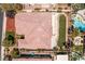 An aerial view showcasing the home's roof, well-manicured lawn, landscaping, and adjacent swimming pool at 2846 Barrow Downs St, Las Vegas, NV 89135