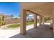 Inviting backyard patio with a covered area supported by sturdy columns, offering a perfect outdoor space at 2846 Barrow Downs St, Las Vegas, NV 89135