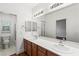 Spacious bathroom featuring a double vanity and a separate toilet room at 2846 Barrow Downs St, Las Vegas, NV 89135