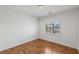 Simple bedroom with hardwood floors and shuttered windows at 2846 Barrow Downs St, Las Vegas, NV 89135