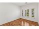 Bright bedroom with wood floors and shuttered windows at 2846 Barrow Downs St, Las Vegas, NV 89135