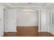 Inviting dining room offers wood floors, white walls, and modern chandelier at 2846 Barrow Downs St, Las Vegas, NV 89135