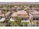 An aerial view of the home featuring a large, well maintained backyard, landscaping and covered patio at 2846 Barrow Downs St, Las Vegas, NV 89135