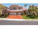 Two-story home boasts a well-manicured lawn, three-car garage and mature trees for added curb appeal at 2846 Barrow Downs St, Las Vegas, NV 89135