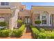 Charming front entrance with manicured hedges, stone accents, and double doors adds curb appeal at 2846 Barrow Downs St, Las Vegas, NV 89135