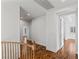 Bright hallway featuring hardwood floors and fresh, white paint leading to bedrooms at 2846 Barrow Downs St, Las Vegas, NV 89135