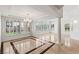 Spacious living area with marble floors, bright chandelier, shuttered windows and plenty of natural light at 2846 Barrow Downs St, Las Vegas, NV 89135
