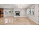 Spacious living room features a fireplace, tile floors, plantation shutters, and recessed lighting at 2846 Barrow Downs St, Las Vegas, NV 89135