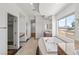A bright primary bathroom with a large soaking tub and dual vanities at 2846 Barrow Downs St, Las Vegas, NV 89135