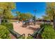 Community playground area featuring a slide, climbing structures, and benches at 2846 Barrow Downs St, Las Vegas, NV 89135