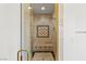 Shower featuring bench seating, a mosaic tile backsplash and bronze trim at 2846 Barrow Downs St, Las Vegas, NV 89135