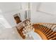 Elegant staircase with wood banister and crystal chandelier in bright, modern home at 2846 Barrow Downs St, Las Vegas, NV 89135