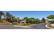 Scenic street view of Willow Creek entrance with lush landscaping and palm trees at 2846 Barrow Downs St, Las Vegas, NV 89135