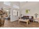 Spacious living room featuring hardwood floors, natural light, and decorative vases at 2913 Laverton Dr, Las Vegas, NV 89134