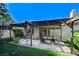 Green backyard featuring shaded patio and dining area at 3013 Plaza De Rosa, Las Vegas, NV 89102
