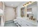 Updated bathroom featuring double sinks, gold fixtures, and walk-in shower at 3013 Plaza De Rosa, Las Vegas, NV 89102