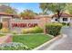 Entrance to Spanish Oaks featuring landscaped grounds and stone accents at 3013 Plaza De Rosa, Las Vegas, NV 89102