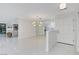 Stylish entryway featuring pristine white walls and floors, modern lighting, and an open layout at 3013 Plaza De Rosa, Las Vegas, NV 89102