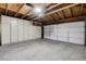 Spacious garage with built-in storage cabinets and a well-lit area for parking and projects at 3013 Plaza De Rosa, Las Vegas, NV 89102