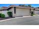 Garage with neutral color scheme and brick-lined driveway at 3013 Plaza De Rosa, Las Vegas, NV 89102
