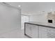 Updated Kitchen featuring a large stone accent wall and marble floors at 3013 Plaza De Rosa, Las Vegas, NV 89102