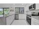 Modern kitchen featuring white cabinets, stainless steel appliances, and sleek countertops at 3013 Plaza De Rosa, Las Vegas, NV 89102