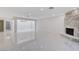 Spacious living room with fireplace and marble floors, great for entertaining at 3013 Plaza De Rosa, Las Vegas, NV 89102