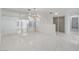 Bright living space featuring white walls, marble floors, and modern lighting at 3013 Plaza De Rosa, Las Vegas, NV 89102
