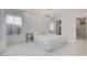 Bright main bedroom featuring light floors, neutral walls, and walk-in closet at 3013 Plaza De Rosa, Las Vegas, NV 89102