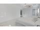 Brightly lit bedroom featuring marble floors, modern lighting, and neutral paint at 3013 Plaza De Rosa, Las Vegas, NV 89102