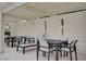 Stylish outdoor patio featuring modern seating arrangements with pergola and bright white brick walls at 3013 Plaza De Rosa, Las Vegas, NV 89102