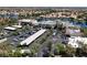 An aerial view of the area showcases a neighborhood of houses surrounding a lake at 3053 Anchor Chain Dr, Las Vegas, NV 89128