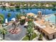 Aerial view of community amenities featuring the lake, clubhouse, and lush landscaping at 3053 Anchor Chain Dr, Las Vegas, NV 89128