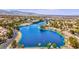 Scenic aerial view of the community lake with lush landscaping and serene waters at 3053 Anchor Chain Dr, Las Vegas, NV 89128