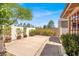 Cozy backyard featuring a stone walkway, potted plants, and a well-maintained stucco wall at 3053 Anchor Chain Dr, Las Vegas, NV 89128