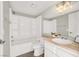 This bathroom has a white shower over tub, toilet, and vanity with wood countertop at 3053 Anchor Chain Dr, Las Vegas, NV 89128