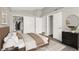 This is a bedroom with a queen bed, a closet, and an dresser with decorative objects at 3053 Anchor Chain Dr, Las Vegas, NV 89128