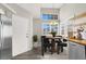 Charming breakfast nook with a round table, a view from windows, and modern appliances at 3053 Anchor Chain Dr, Las Vegas, NV 89128