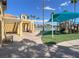 Community amenity with playground near benches with lake view at 3053 Anchor Chain Dr, Las Vegas, NV 89128