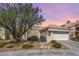 Charming single-story home with a tile roof, mature landscaping, and a two-car garage at 3053 Anchor Chain Dr, Las Vegas, NV 89128