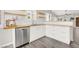Modern kitchen showcasing white cabinetry, butcher block counters, and stainless steel dishwasher at 3053 Anchor Chain Dr, Las Vegas, NV 89128