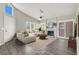 Bright living room featuring vaulted ceilings, a cozy fireplace, and access to the backyard at 3053 Anchor Chain Dr, Las Vegas, NV 89128