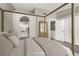 This main bedroom features a four-poster bed, closet, arched doorway, and a washer and dryer at 3053 Anchor Chain Dr, Las Vegas, NV 89128