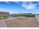 Aerial view showcases the home's backyard with pool and desert landscaping at 341 Waterwheel Falls Dr, Henderson, NV 89015