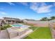 Serene backyard with pool, spa, and manicured green space at 341 Waterwheel Falls Dr, Henderson, NV 89015