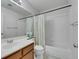 Bathroom with a single sink vanity, a toilet, and a shower-tub combo with a shower curtain at 341 Waterwheel Falls Dr, Henderson, NV 89015