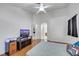 A bright bedroom featuring a ceiling fan and hard surface flooring at 341 Waterwheel Falls Dr, Henderson, NV 89015