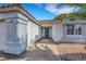 Entrance of home featuring a tiled walkway leading to a dark steel door at the front of the property at 341 Waterwheel Falls Dr, Henderson, NV 89015