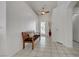 A bright foyer with tile floors, a wooden bench, and a decorative vase at 341 Waterwheel Falls Dr, Henderson, NV 89015